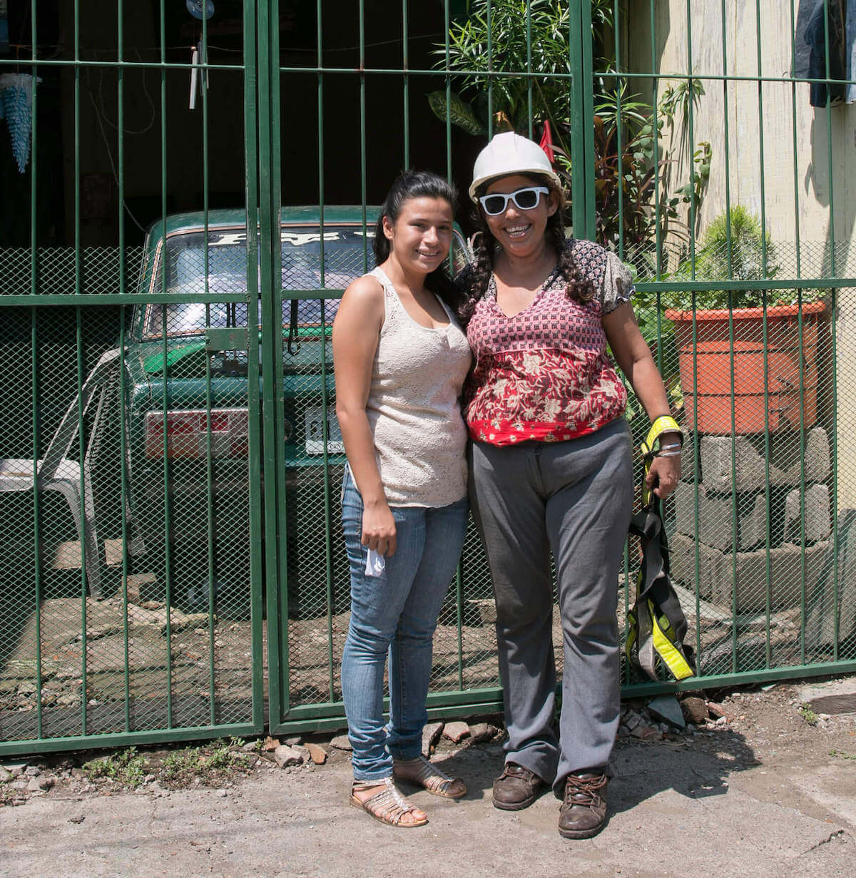 Gertrudis and her daughter Jacksiry outside of their home in Corinto, Nicaragua.