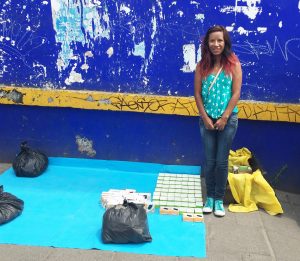 Fernanda next to her celular equipment stand in Xochimilco, Mexico. 